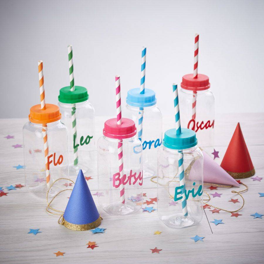 personalised children's party bottles by pink biscuits