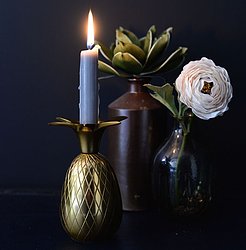 A gorgeous pineapple candle holder in facted gold 
