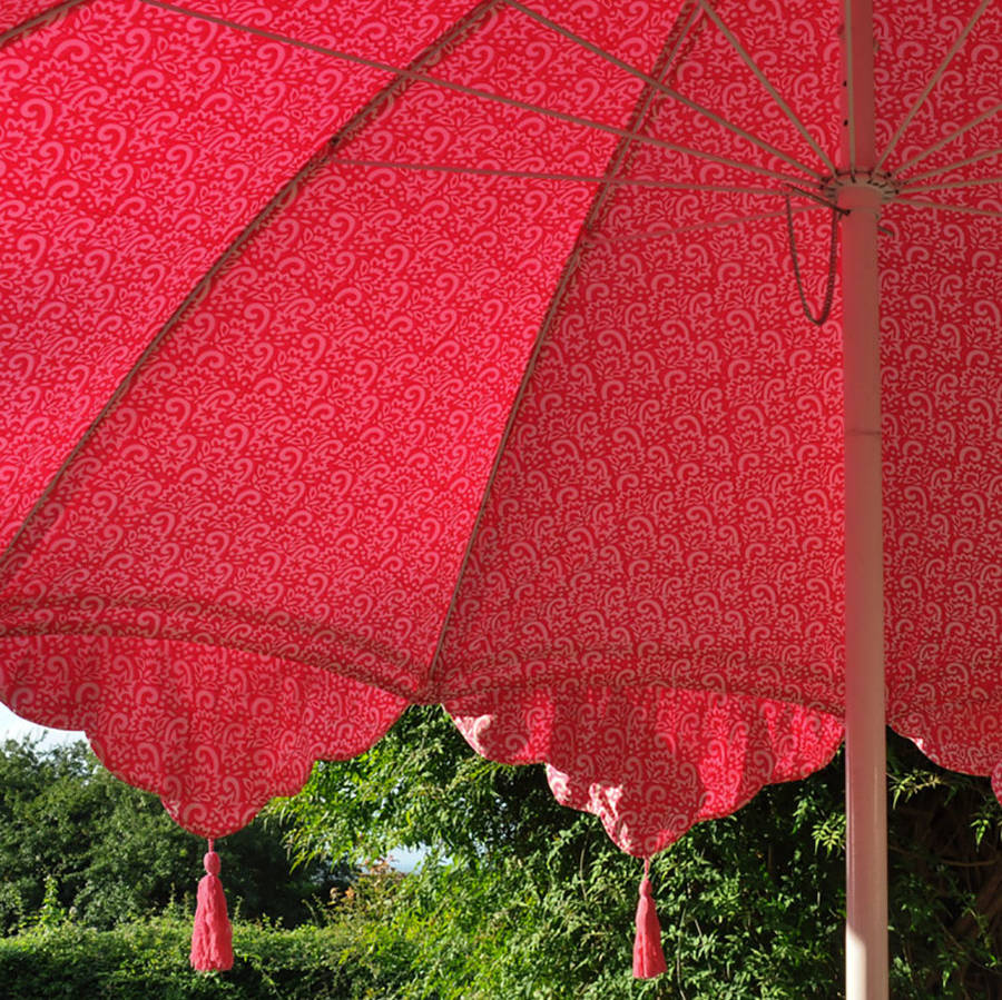 garden parasol with tassels and ribbons by east london parasol company