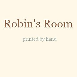 Robin's Room logo in dark brown text followed by the words printed by hand in pale grey text
