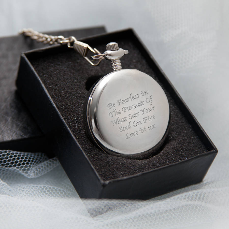 engraved silver pocket watch with magnifying glass by