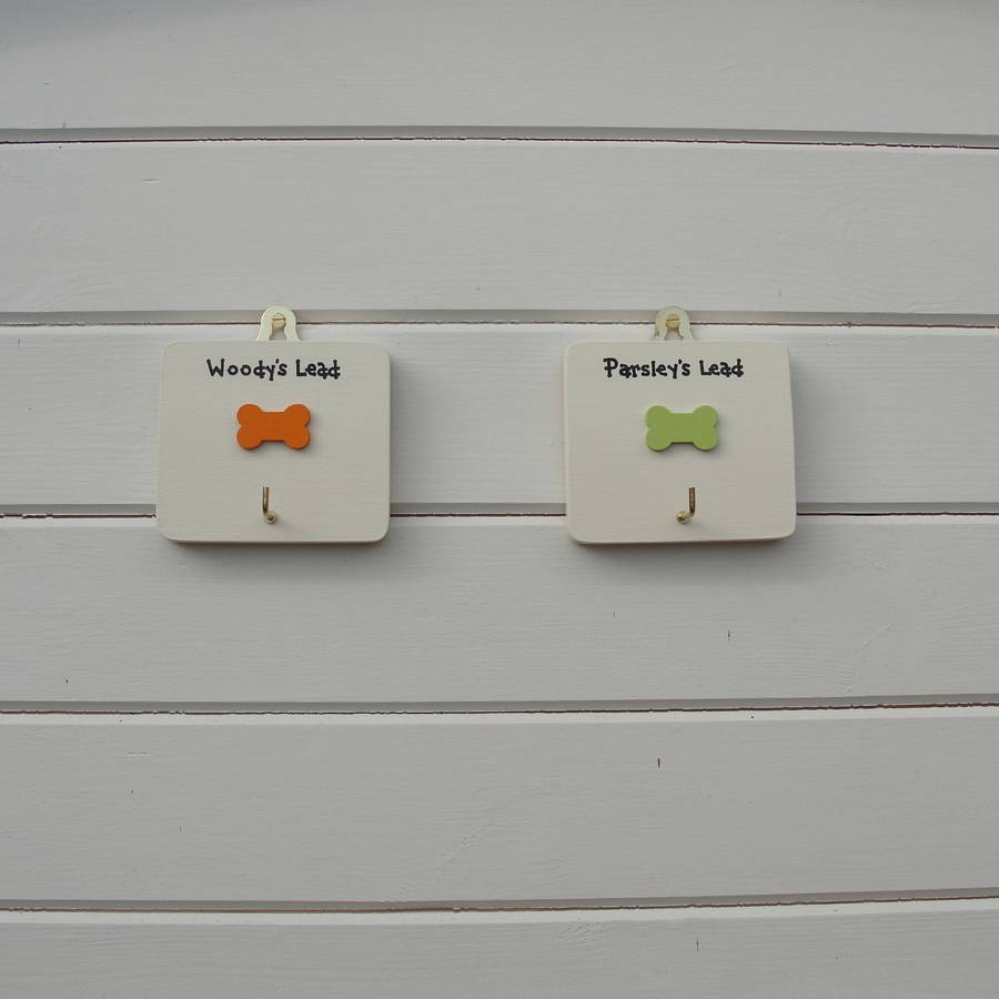 two personalised dog lead holders/hangers by siop gardd