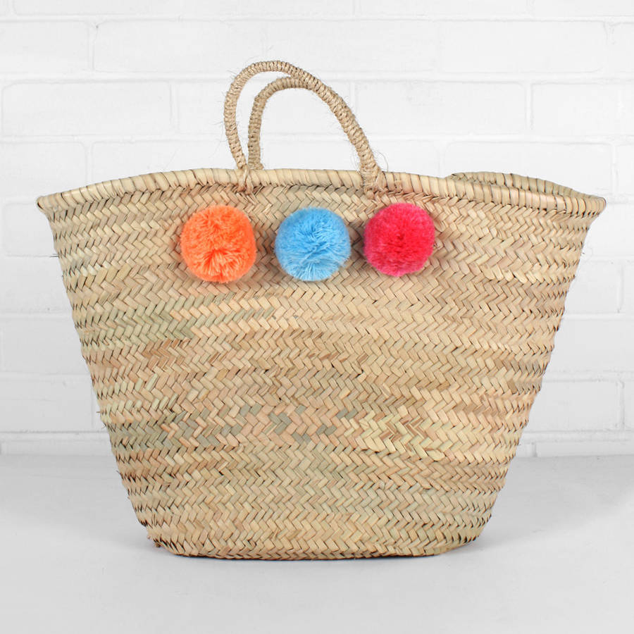 multi coloured market pom pom basket by bohemia