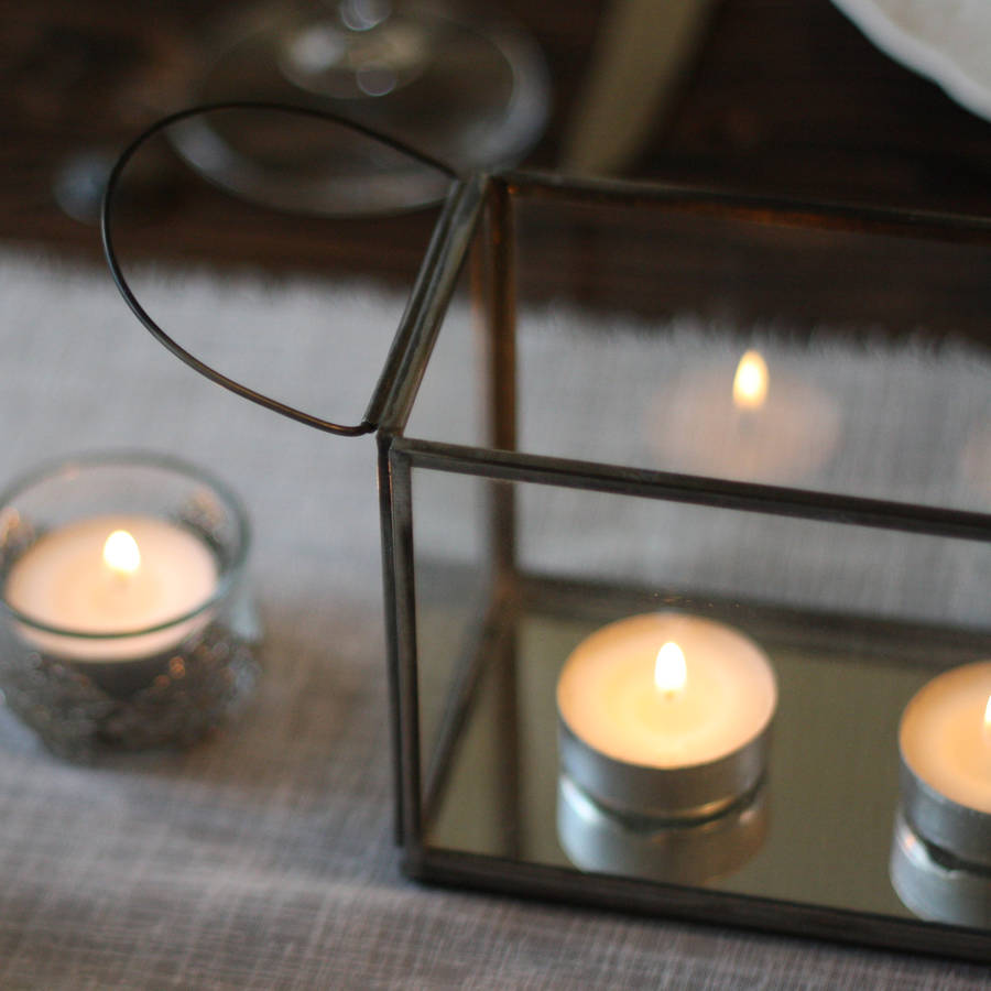 long glass and mirror tea light holder with metal frame by the wedding