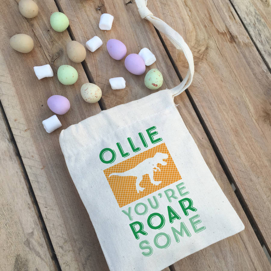 personalised dinosaur easter bag with sweets by claire close