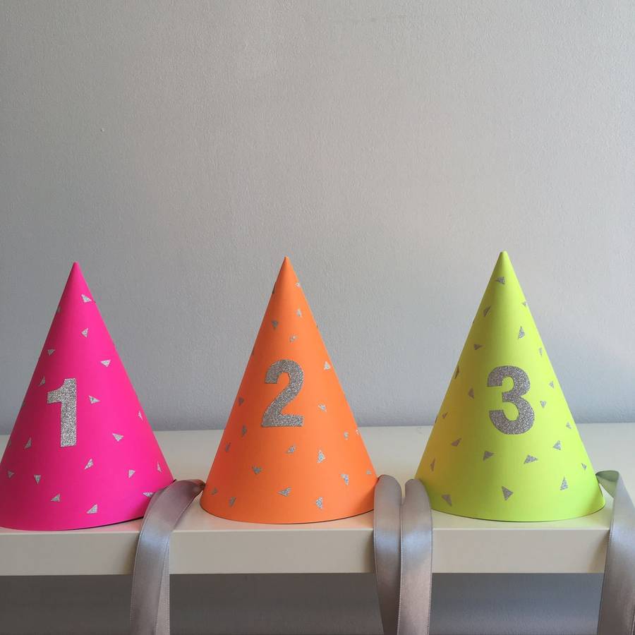 neon triangle party hat with number balloon garland by minitinsel