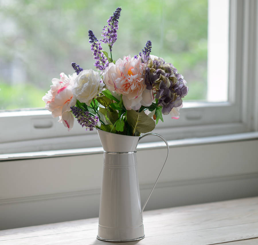 silk peony and hydrangea flowers with farmhouse jug by the flower