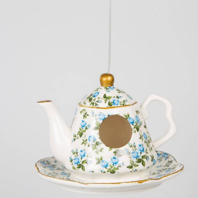 ceramic hanging teapot bird feeder with bird food by thelittleboysroom