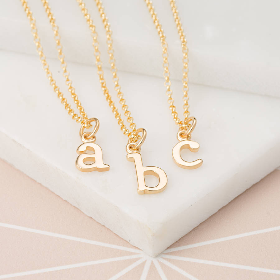 gold initial charm necklace by lily charmed | notonthehighstreet.com