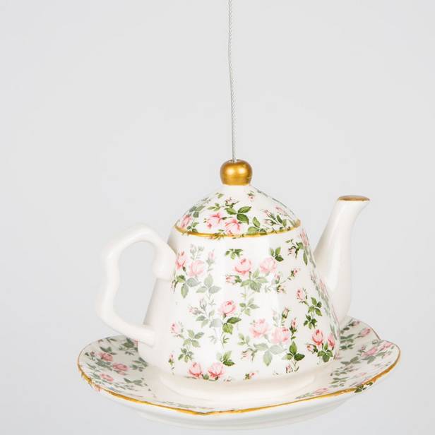 ceramic hanging teapot bird feeder with bird food by thelittleboysroom