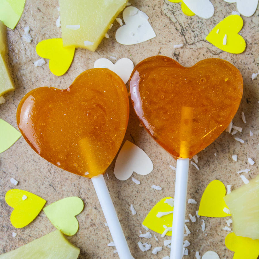 five heart shape alcoholic pina colada lollipops by holly's lollies