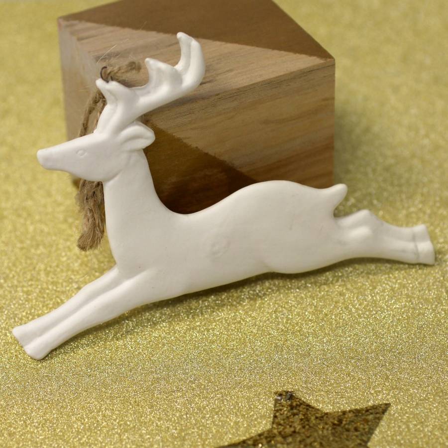 pair of white ceramic reindeer by posh totty designs interiors