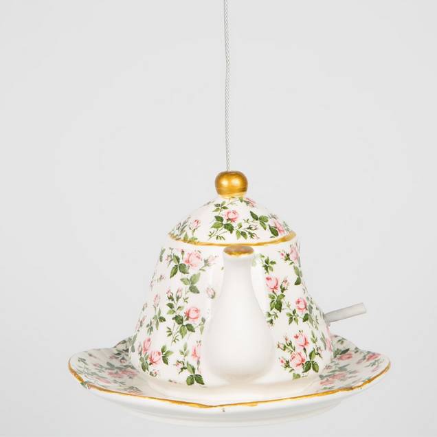 ceramic hanging teapot bird feeder with bird food by thelittleboysroom