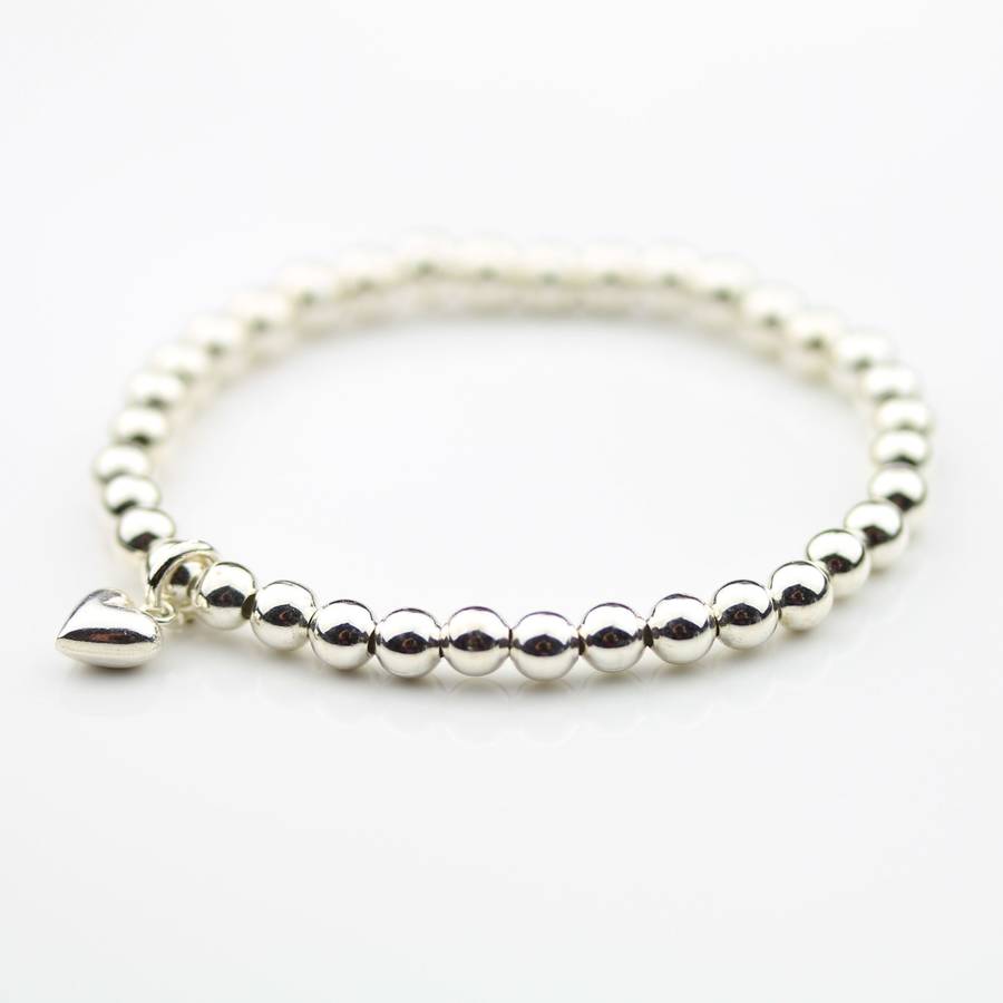 children's silver bracelet with silver heart charm by nest