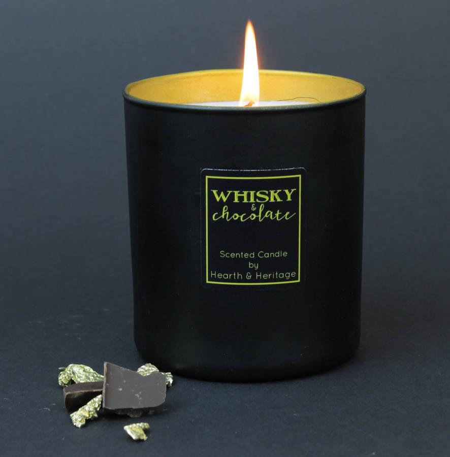 whisky and chocolate scented candle in black glass by hearth & heritage