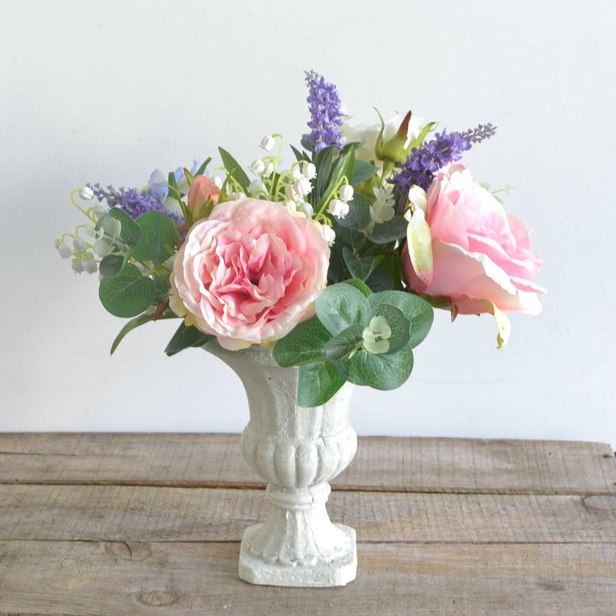 everlasting rose bouquet in cream urn by abigail bryans designs