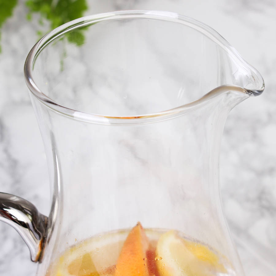 glass handled serving jug with stirrer by dibor