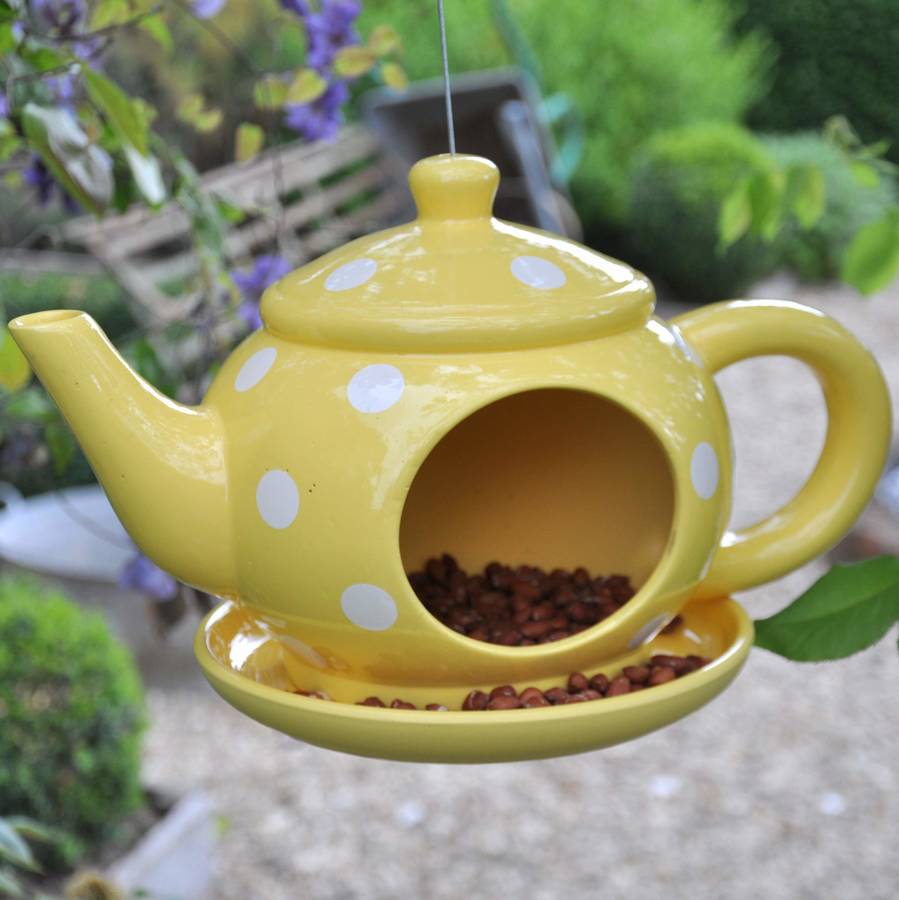 spotty ceramic teapot bird feeder by the orchard