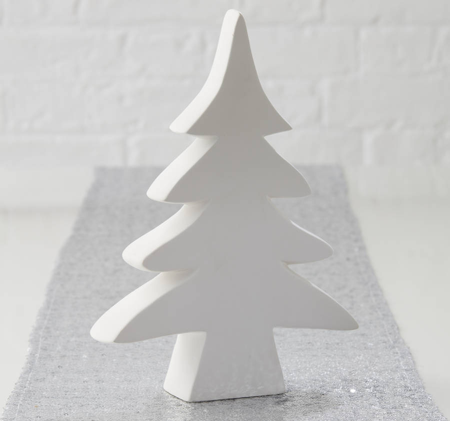 white table christmas tree by the christmas home