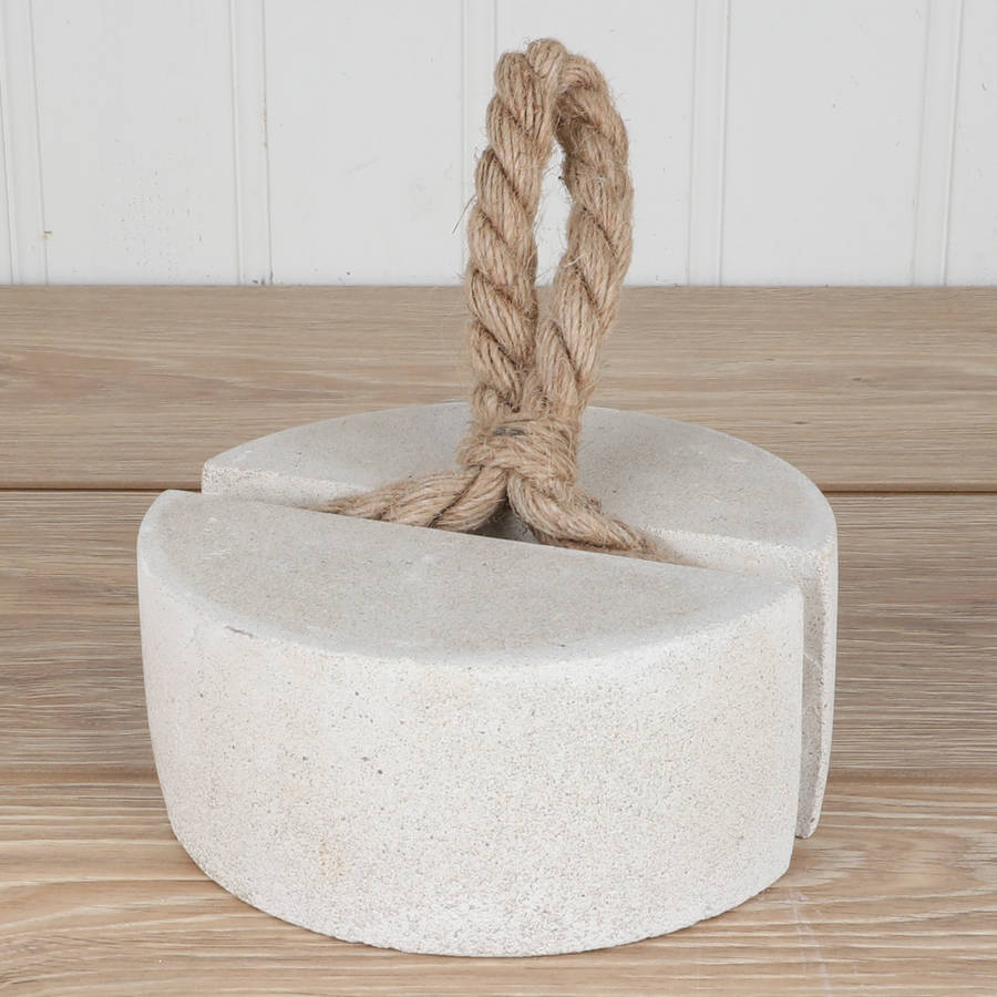 concrete circular door stop with rope loop handle by dibor