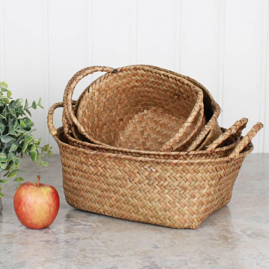 set of four oval wheat straw baskets by dibor