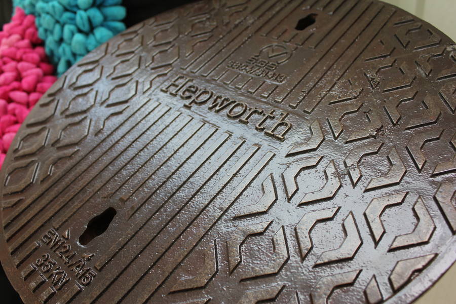 lefton reclaimed manhole cover side table by urban grain