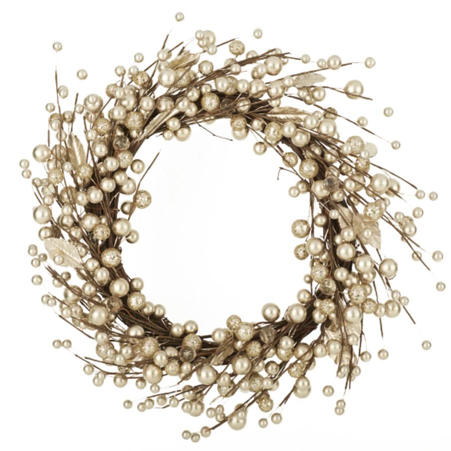 gold berry christmas wreath or garland by the christmas home
