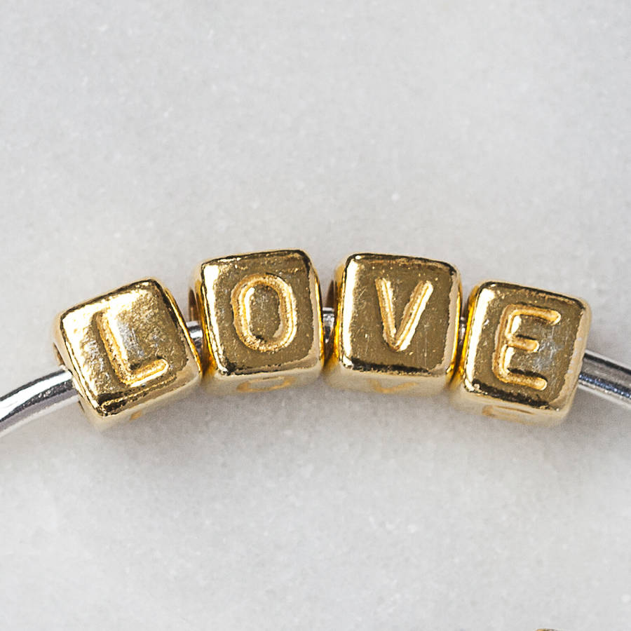 'love' bangle by cabbage white england