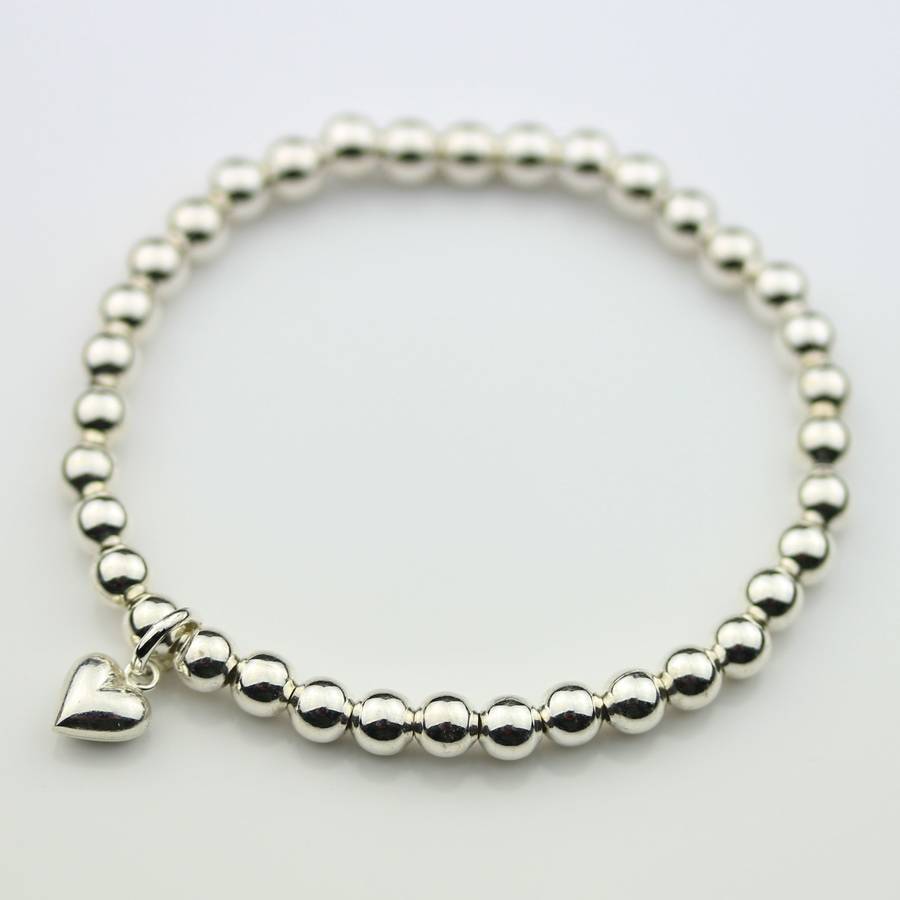 children's silver bracelet with silver heart charm by nest