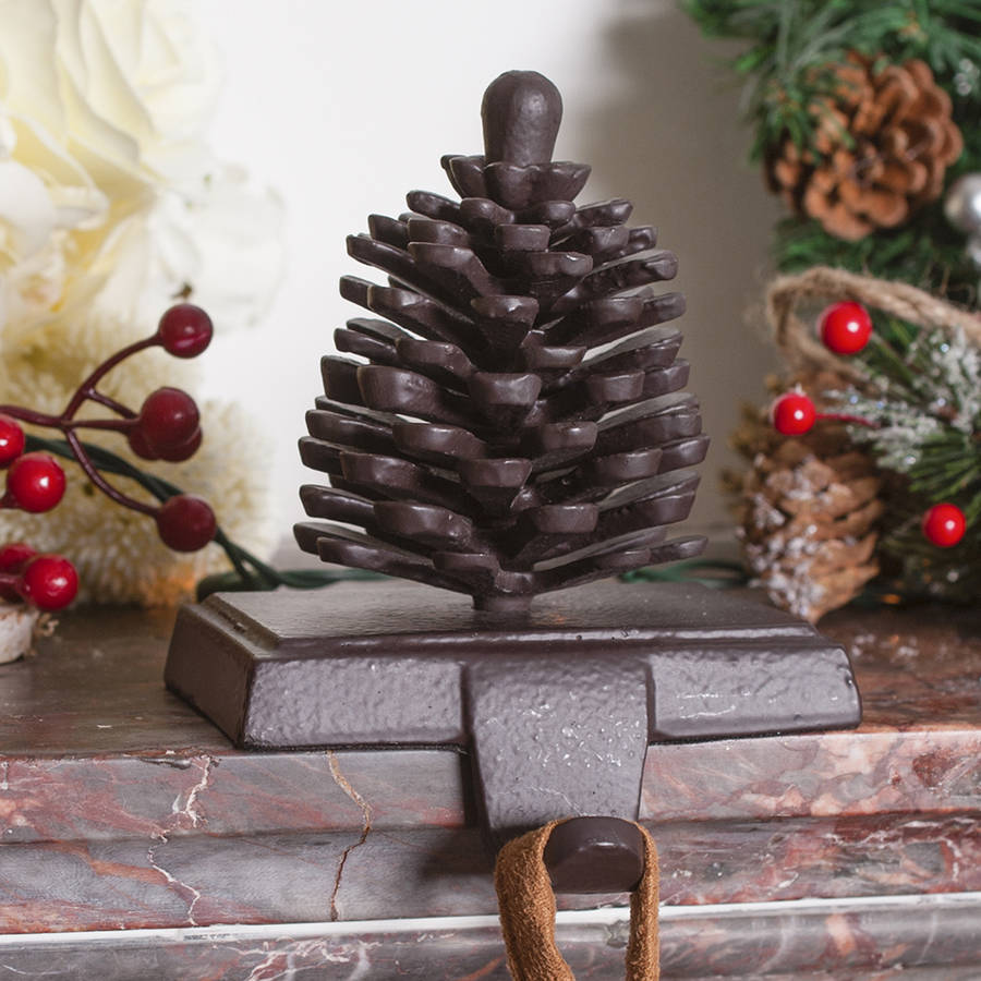 cast iron pine cone christmas stocking holder by dibor