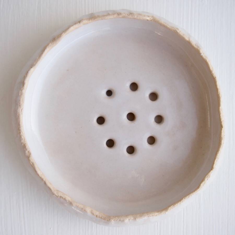 a handmade white pottery soap dish by