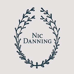 Nic Danning Jewellery logo. Crescent moon motif with rays of light rising from the text reading Nic Danning.