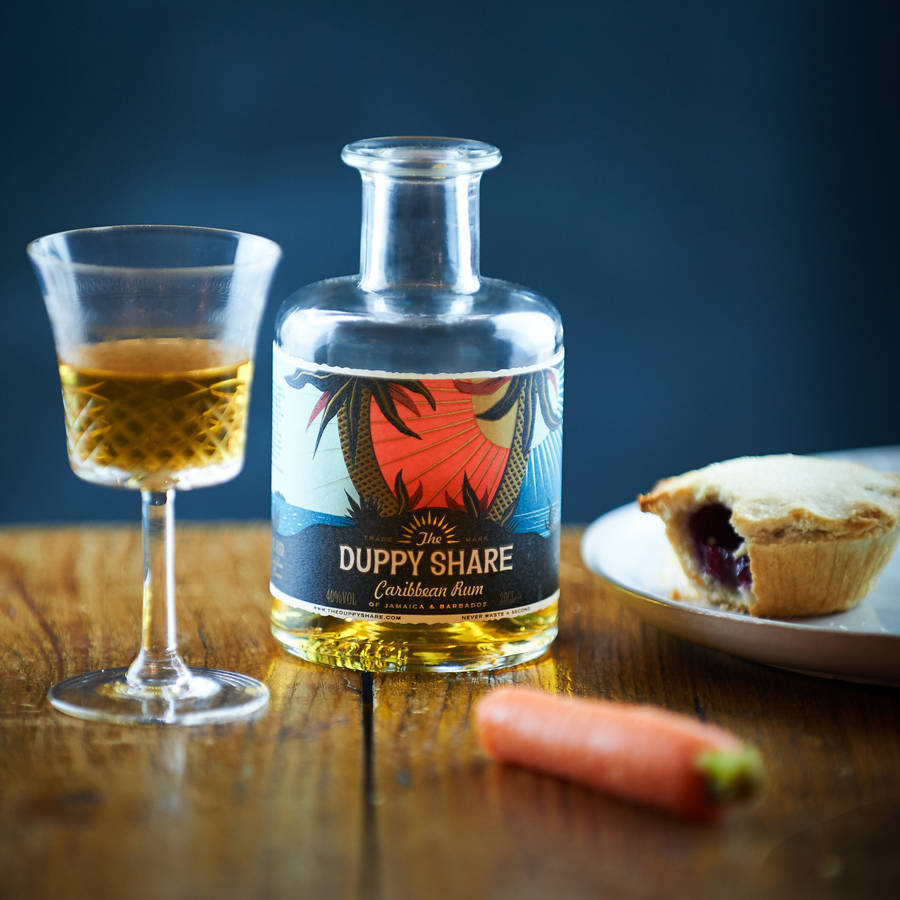 taster bottle of golden rum with cocktail recipes by the duppy share