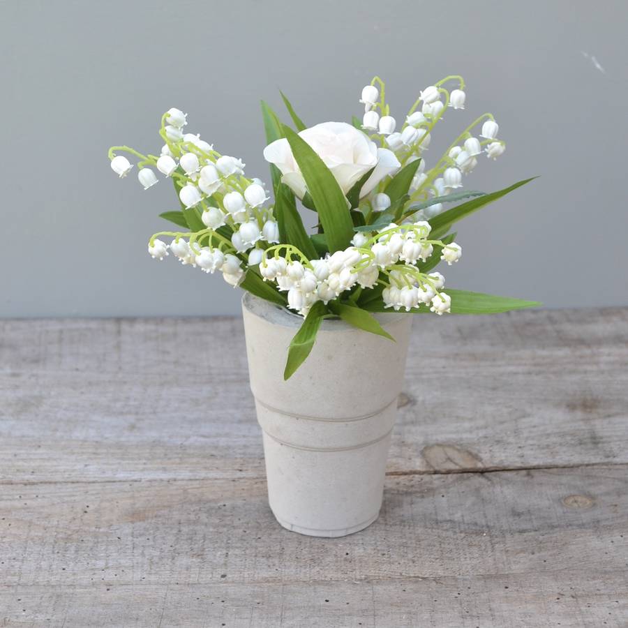 faux lily of the valley bouquet in cement vase by abigail bryans designs