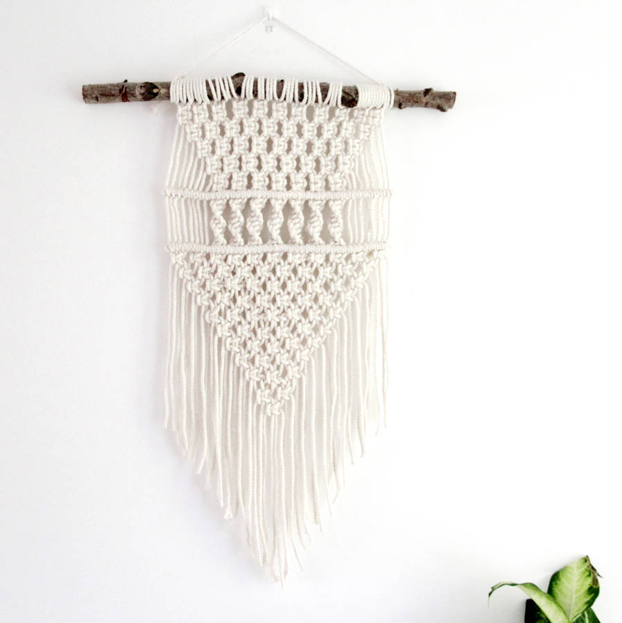 tribal macrame wall hanging by tent living