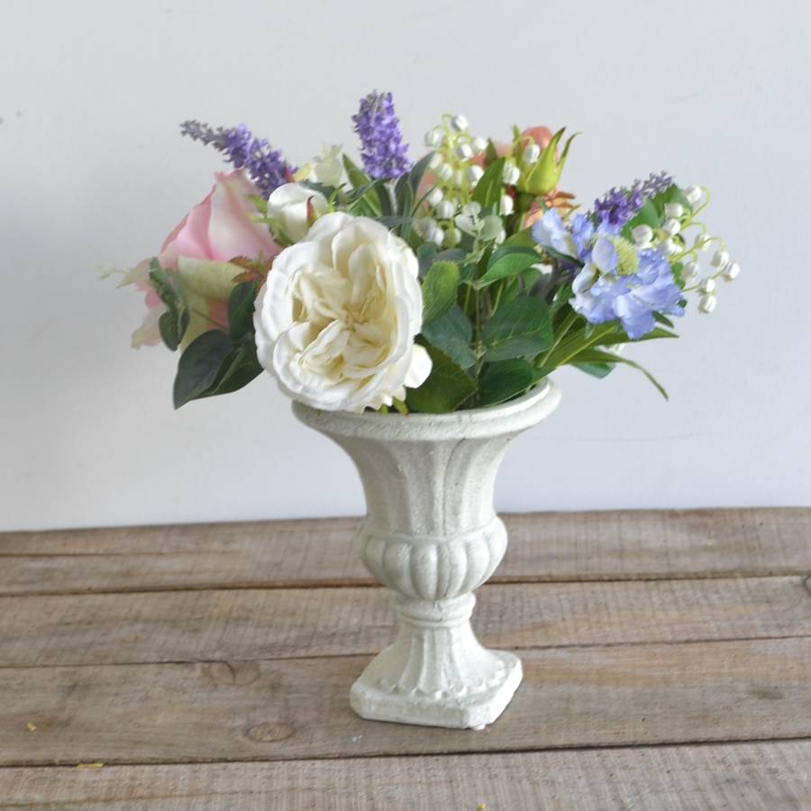 everlasting rose bouquet in cream urn by abigail bryans designs