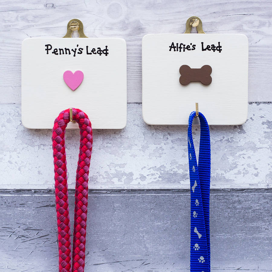 two personalised dog lead holders/hangers by siop gardd