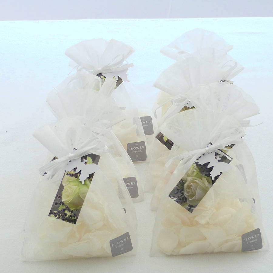 ten hand made white rose petal confetti bags by the flower studio