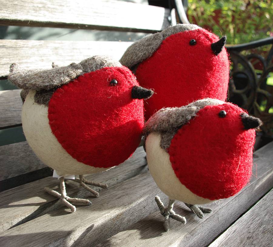 felt robins standing/plain by boxwood