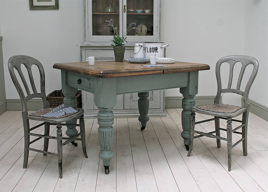 small oval distressed kitchen table