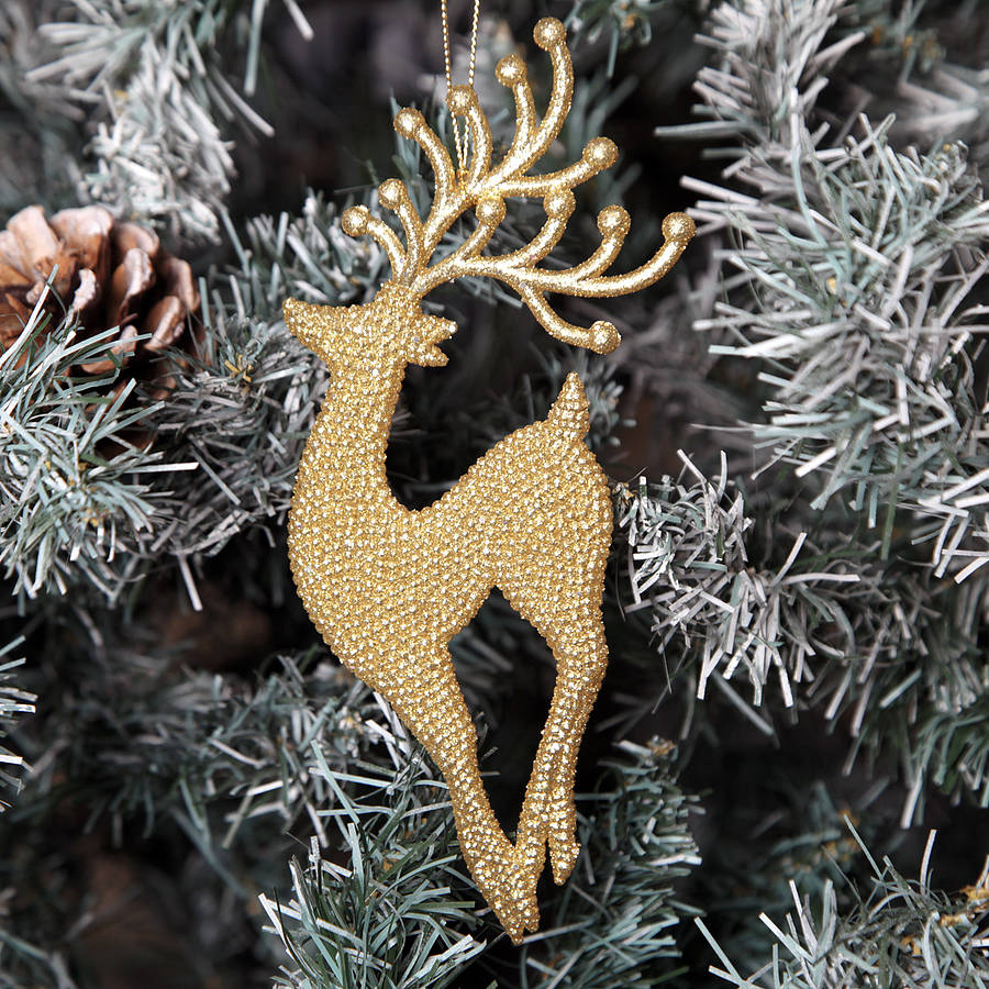 gold tone deer tree decoration by red berry apple
