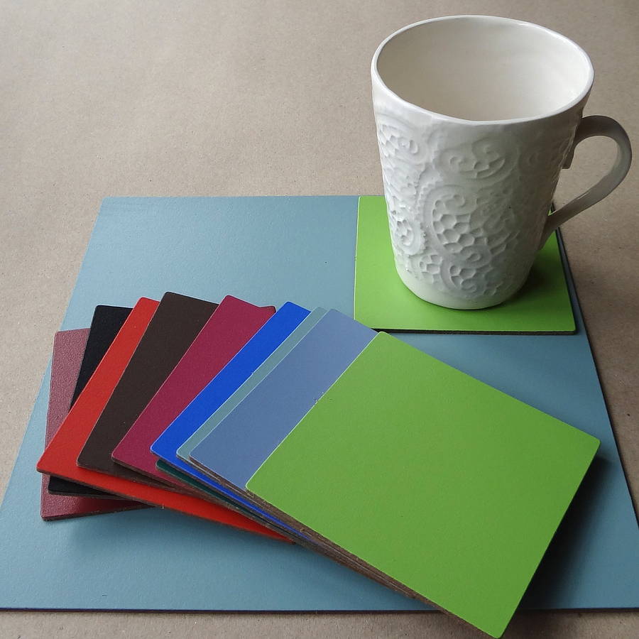 set of four square leather placemats by artbox