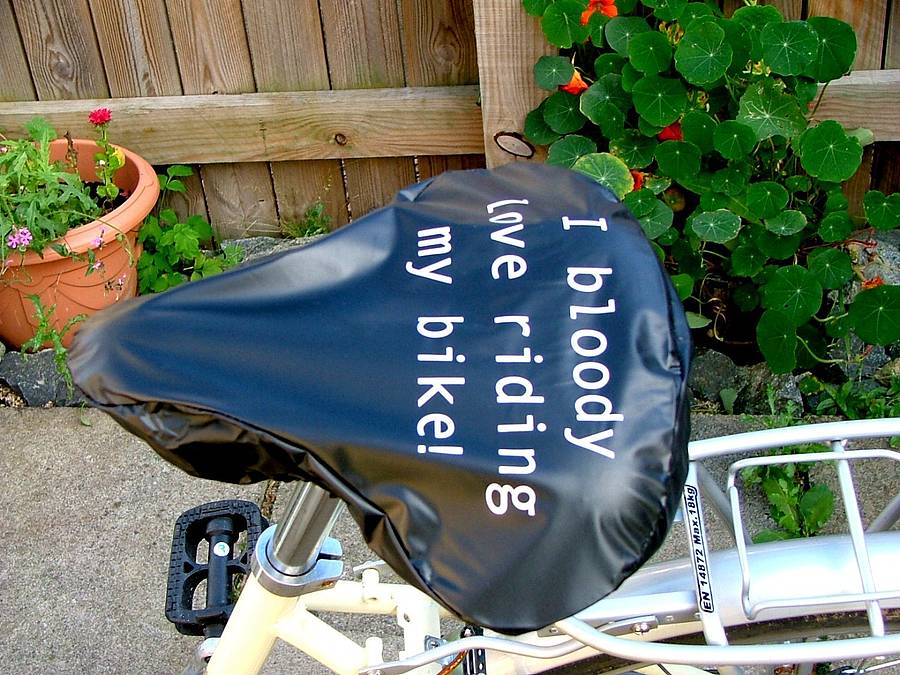 'bloody love riding my bike' bike seat rain cover by kelly connor