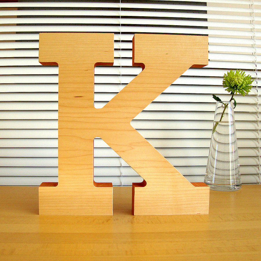 large decorative wooden letter sculpture by designed