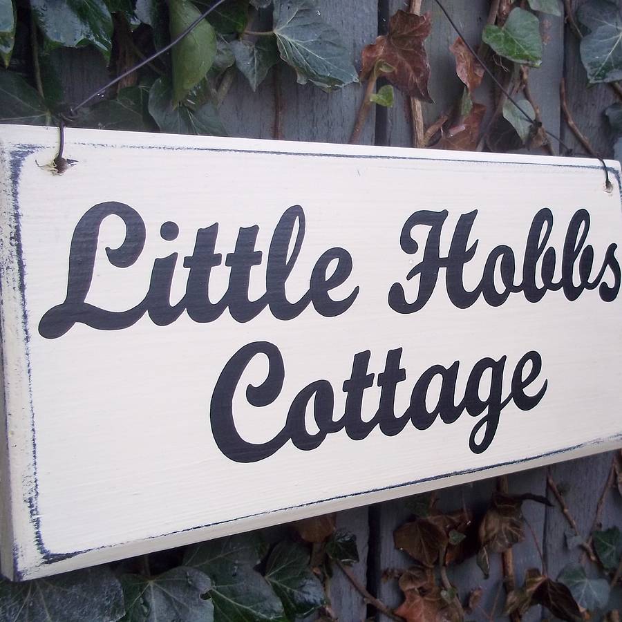 personalised wooden house sign by potting shed designs