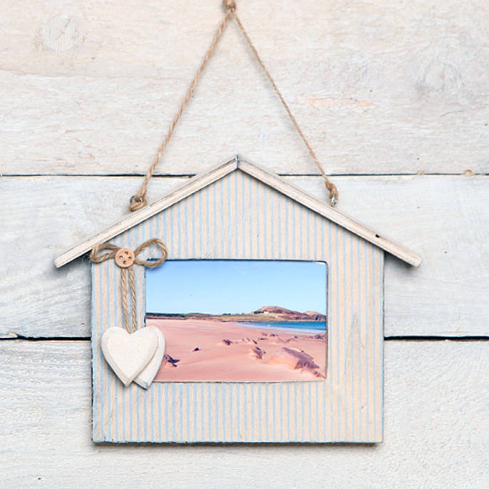striped beach hut hanging picture frame by red berry apple