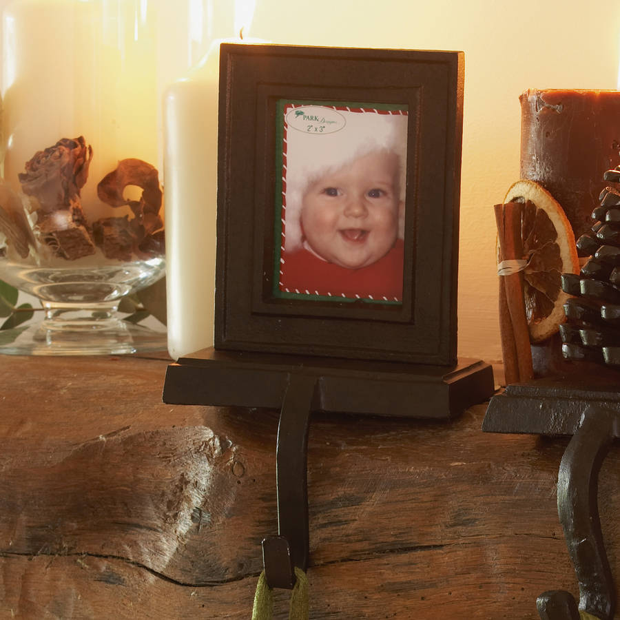cast iron photo frame christmas stocking holder by dibor