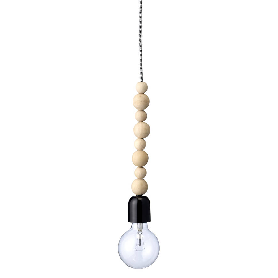 hanging lamp with wooden balls by out there interiors