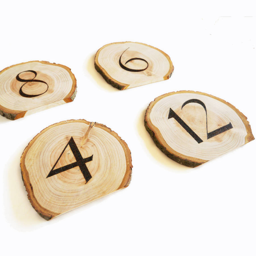 set of personalised wooden table numbers by cairn wood design