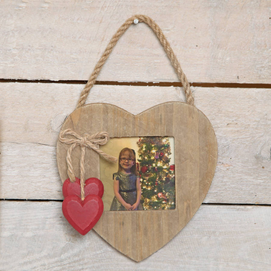 wooden love heart hanging photo frame by red berry apple